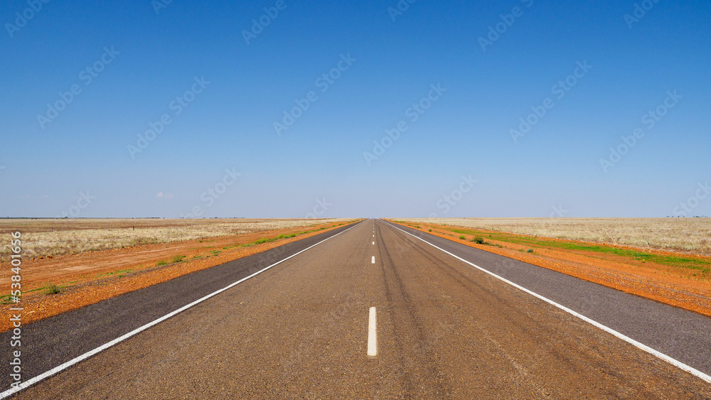 Straight line on an Australian highway through the outback 
