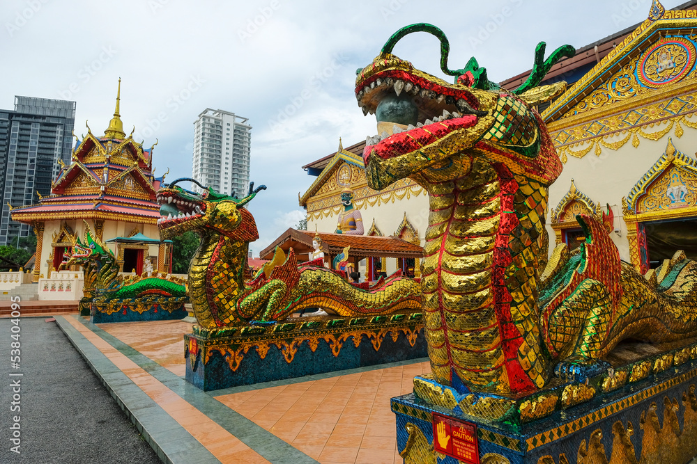 Naklejka premium George Town, Malaysia - October 2022: Views of the Wat Chaiyamangalaram Thai Buddhist Temple in George Town on October 13, 2022 in Penang, Malaysia..