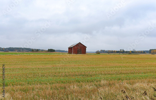 Red and green hay barn in the countryside