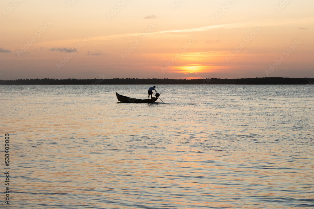 beautiful sunset with a boat on the river