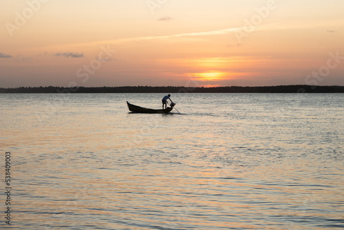 beautiful sunset with a boat on the river