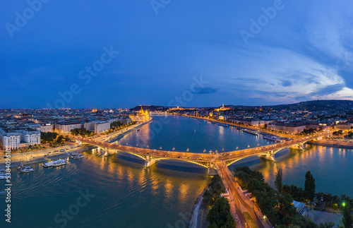 Budapest by night. Hungary - skyline panorama of Budapest in the night. The Danube the Parliament the Chain Bridge and the Buda Castle and the Margaret Bridge in front. Blue hour photo.