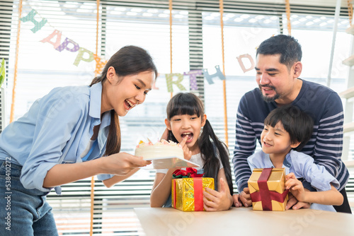 Photography Asian family celebrating birthday together at home