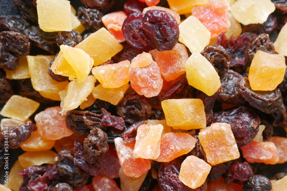close up of colorful fruit gum on black 
