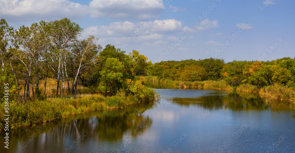 quiet river with forest on coast, autumn natural landscape