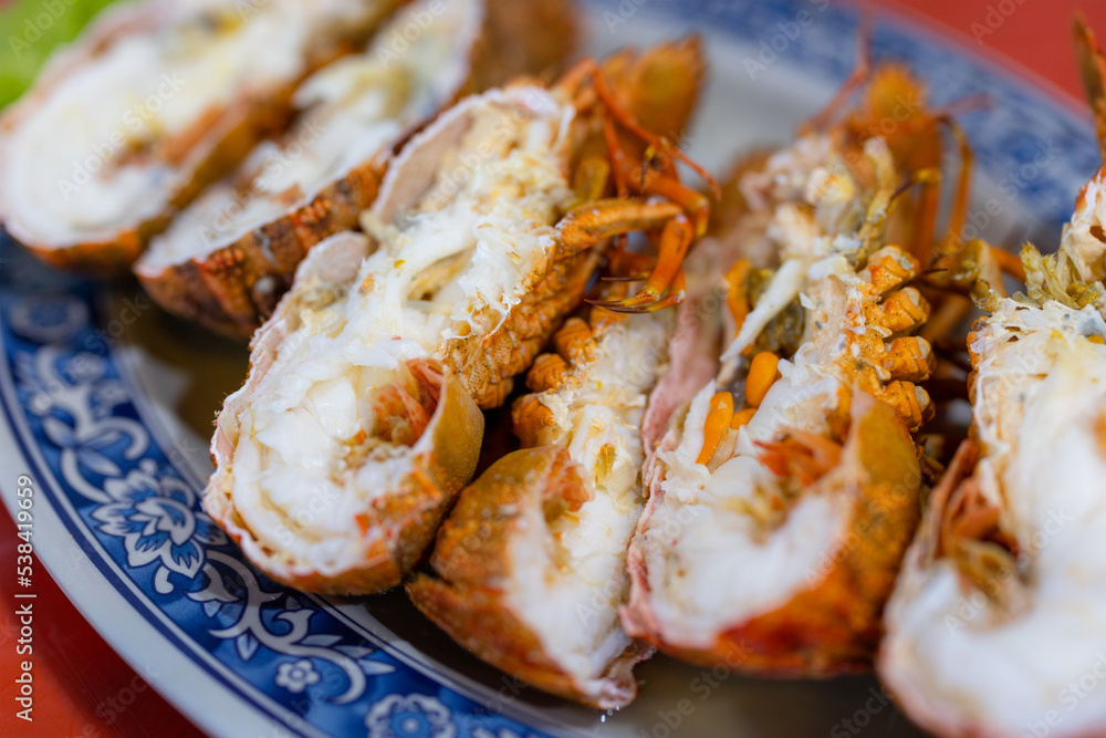 Seafood steamed lobster in vegetable decoration Seafood steamed lobster in vegetable decoration