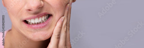 Young Woman Suffering From Toothache