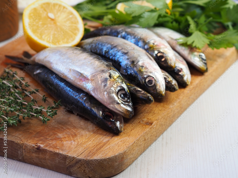 Fresh marine fish sardines with sea salt Fresh marine fish sardines with sea salt