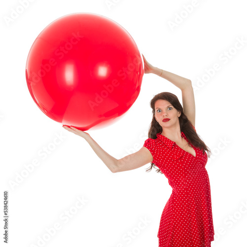 Woman holding big red balloon above her head © Kruwt