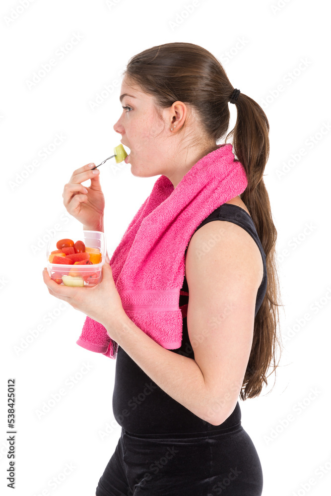 Young woman in sports wear with towel eating fresh fruit, isolated on transparent background Young woman in sports wear with towel eating fresh fruit, isolated on transparent background