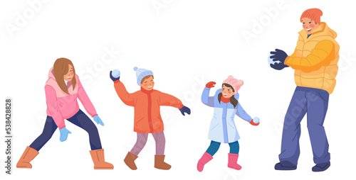 Parents playing snowballs with children. Family outdoor together