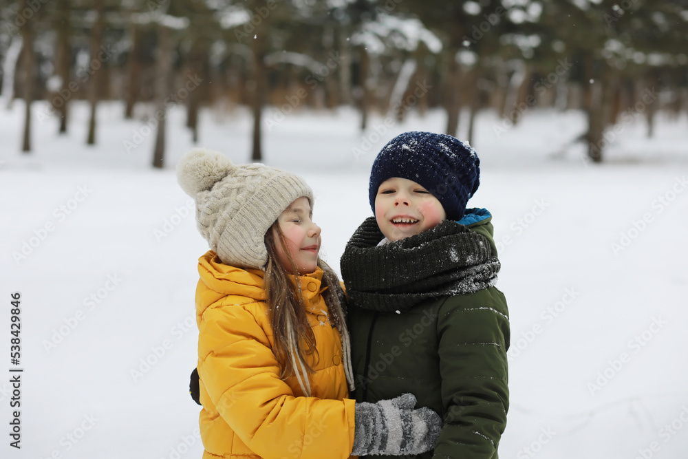 Happy family playing and laughing in winter outdoors in the snow. City park winter day. Happy family playing and laughing in winter outdoors in the snow. City park winter day.