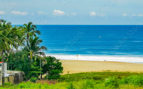 Extremely natural panorama surfer waves at beach Puerto Escondido Mexico.