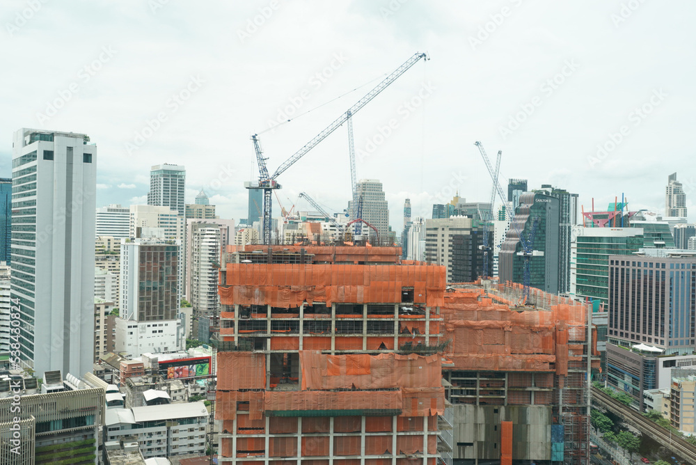 Fototapeta premium Architect and construction engineer or surveyor discussion plans and blueprints