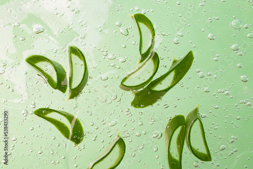 Group of slices of aloe vera in the cosmetics gel with bubbles inside.Cosmetics background.