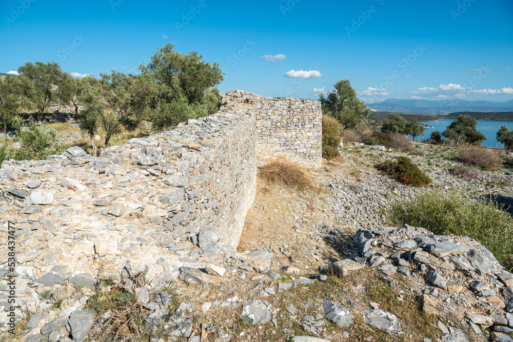 Ruined wall of acropolis, later converted into a fortress, at Iasos ancient site in Mugla province of Turkey.