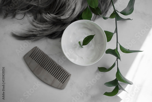 Hair mask, comb on a light background