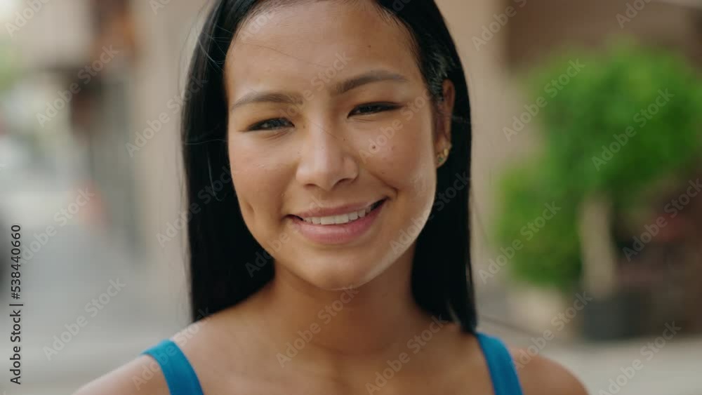 Young beautiful latin woman smiling confident standing at street Young beautiful latin woman smiling confident standing at street