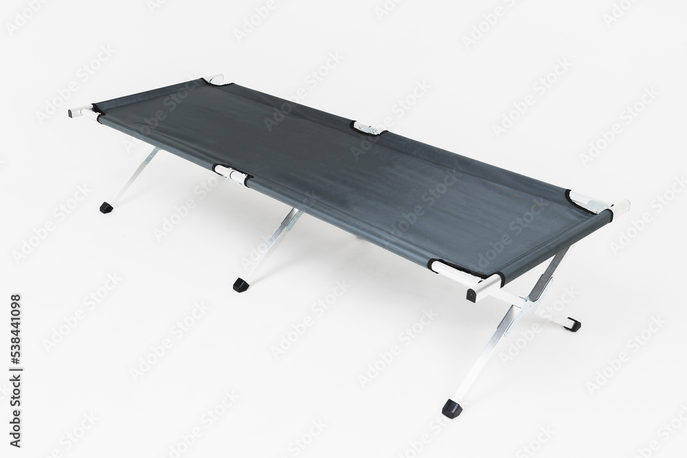 folding bed on a white background military folding bed on a white background military