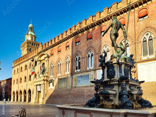 Nettuno 1567 bronze statue and fountain in front of Accursio palace, Piazza Maggiore square, the seat of the municipal government of Bologna city, Italy photo