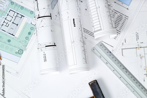 Working tools and drawings of the designer on a white background. Construction of houses, drawing, interior design.