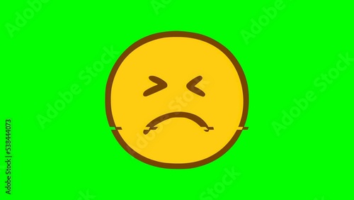 Sad face emoticon glitch effect on green background. Emoji motion graphics.