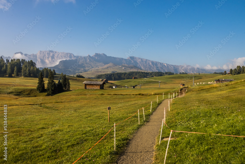 Sunrise on Seiser Alm mountain meadow in Dolomites