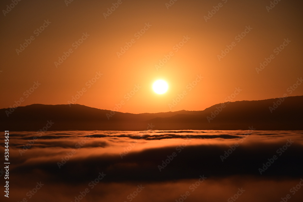 Obraz premium sunrise over the clouds