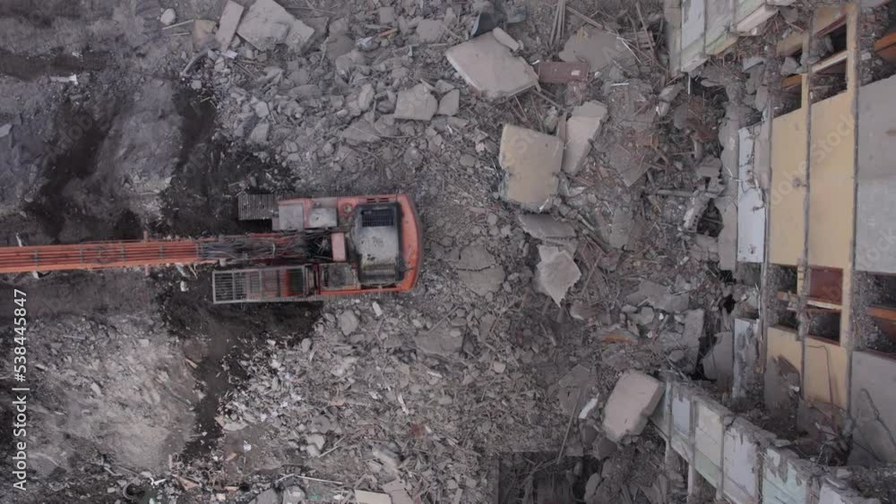 Excavator for dismantling buildings, using a special claw, dismantles a multi-storey building. Ukraine. 4k Excavator for dismantling buildings, using a special claw, dismantles a multi-storey building. Ukraine. 4k