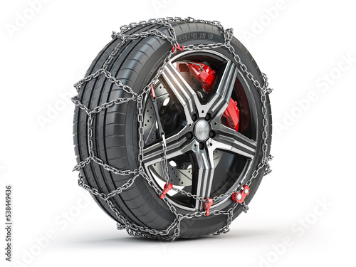 Car wheel with winter tire and snow chain isolated on white background.