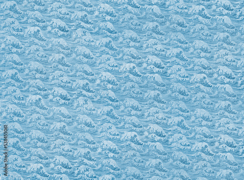 Photograph of highly detailed Japanese traditional wrapping cotton fabric called furoshiki featuring a seamless pattern of a blue sea wave like that of the famous hokusai and used for wrapping goods Fototapet