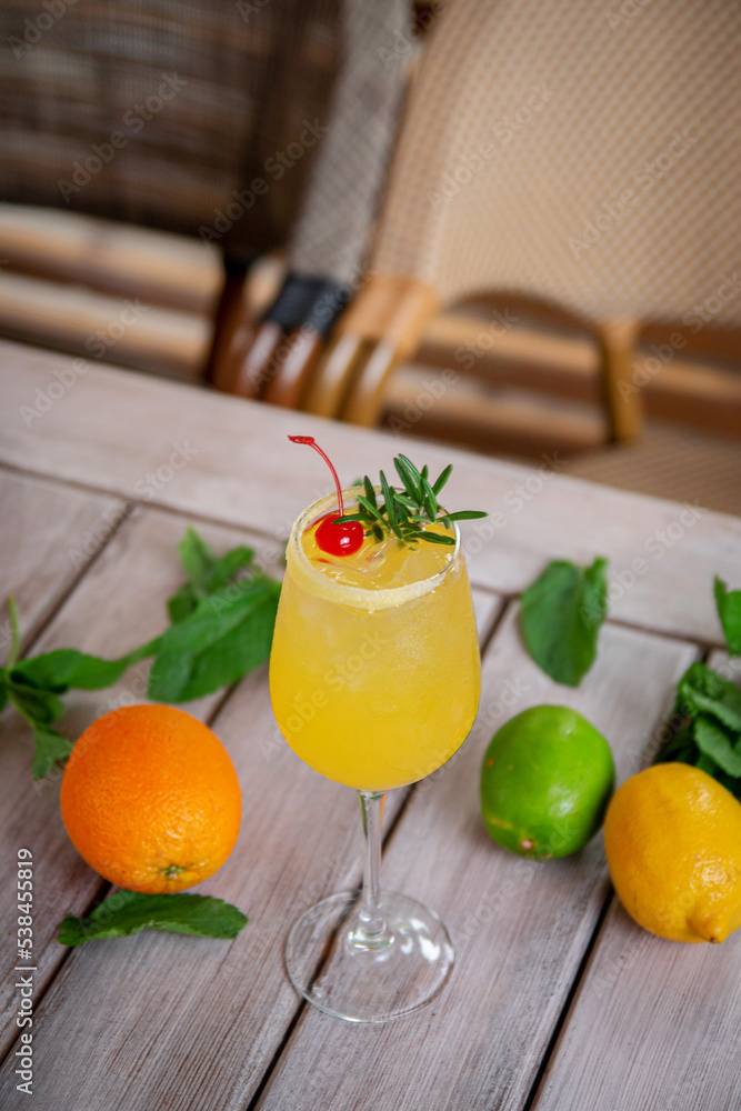 Fototapeta premium alcoholic cocktail winter aperol spritz with rosemary and cherry
