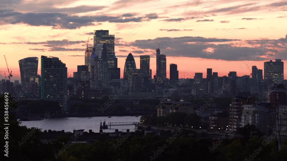 Beautiful sunset in London. Sunset view of London with city skyline and river Thames, England. Sunset London skyline. Sunset view London financial district sun flare. City of London at sunset, UK. Beautiful sunset in London. Sunset view of London with city skyline and river Thames, England. Sunset London skyline. Sunset view London financial district sun flare. City of London at sunset, UK.