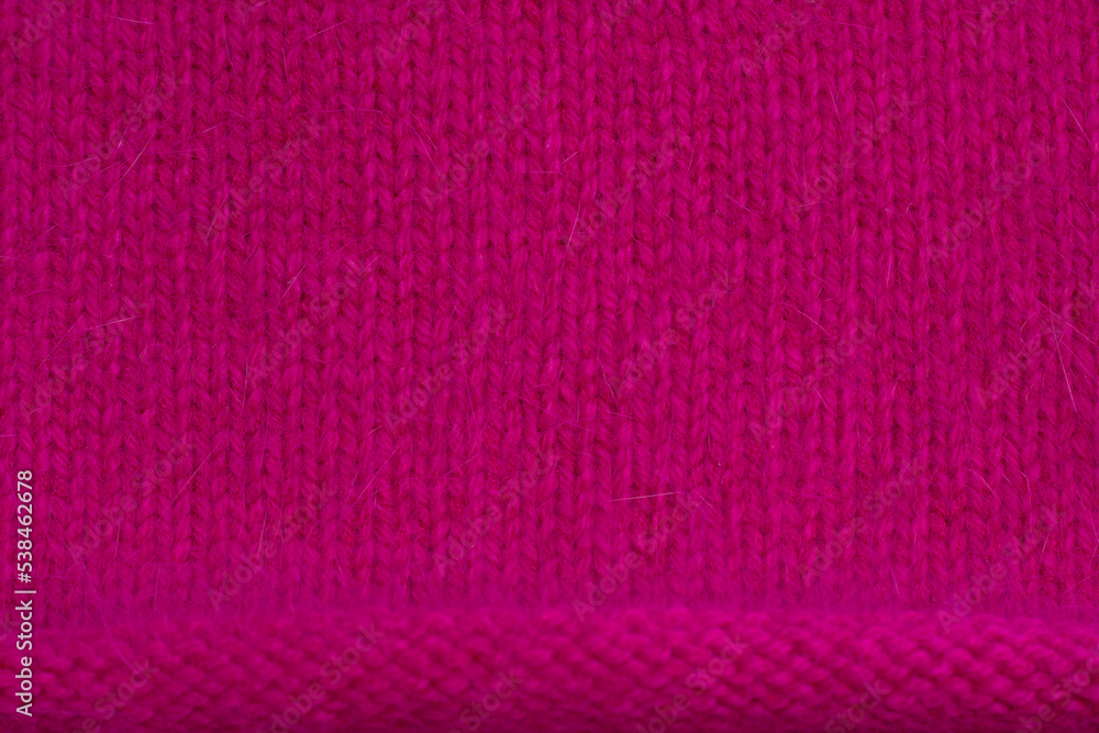 bright pink knitted fabric as a textured backdrop bright pink knitted fabric as a textured backdrop