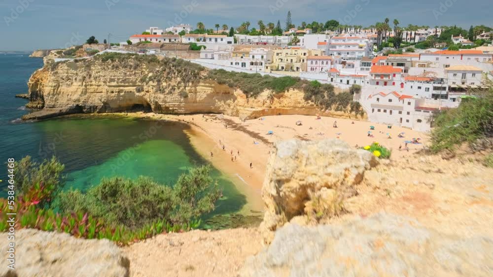 Revealing shot of the beautiful Carvoeiro beach in Algarve, Portugal Revealing shot of the beautiful Carvoeiro beach in Algarve, Portugal