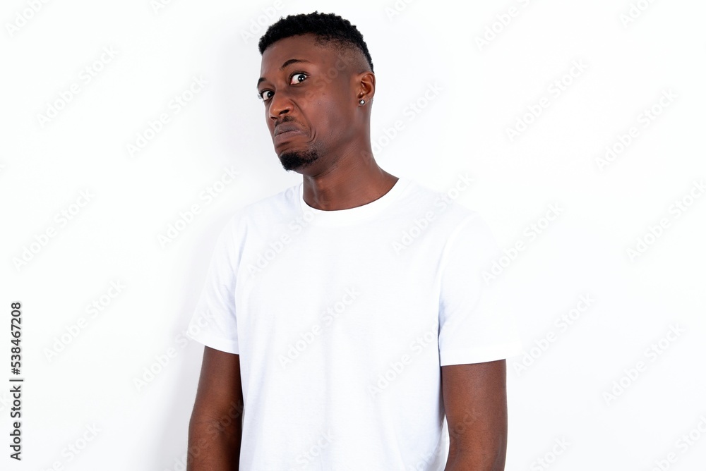 MODEL with snobbish expression curving lips and raising eyebrows, looking with doubtful and skeptical expression, suspect and doubt. MODEL with snobbish expression curving lips and raising eyebrows, looking with doubtful and skeptical expression, suspect and doubt.