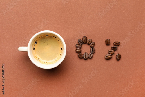 0 percent made of beans and cup with coffee on color background, flat lay. Decaffeinated drink