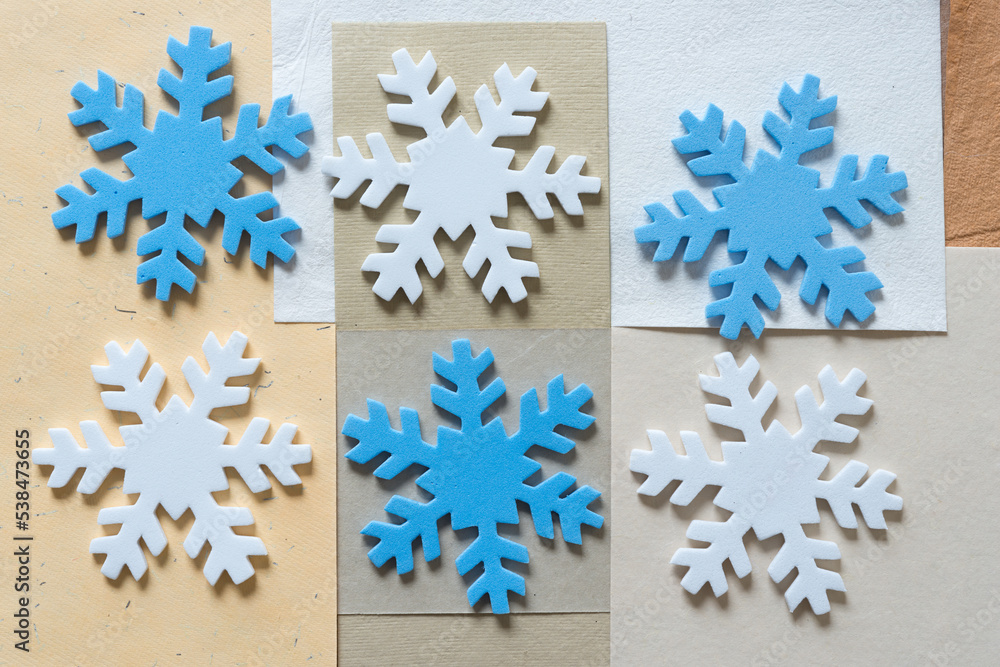 christmas snowflake on a neutral paper background christmas snowflake on a neutral paper background