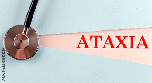 ATAXIA word made on torn paper, medical concept background photo