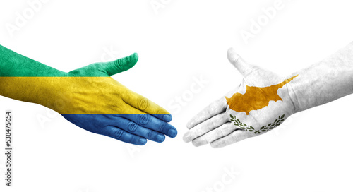 Handshake between Cyprus and Gabon flags painted on hands  isolated transparent image.