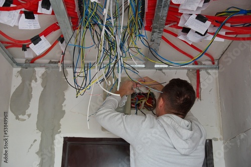 Electrician working on electrical installations