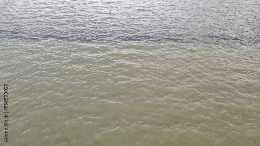 Two Rivers Merging Gif Two rivers of different colors of clean and dirty water merge into one ...