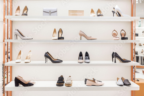 Elegant women's shoes on the shelves in the store. Fashion & Style. Front view.