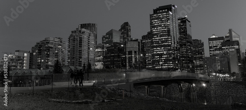 Calgary s cityscape reflected in the river water at dusk.