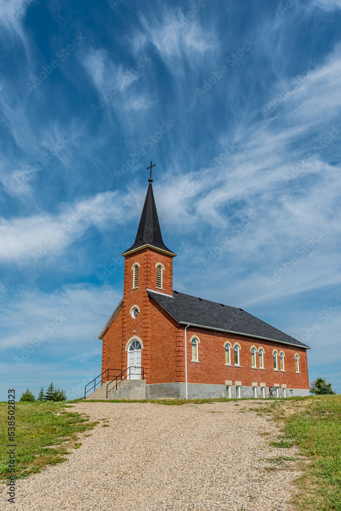Blue sky and clouds over St. Johns Lutheran Church in Edenwold, near Regina, SK 