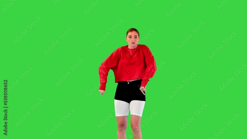 Enthusiastic female dancer performs some contemporary dance movements on a Green Screen, Chroma Key. Enthusiastic female dancer performs some contemporary dance movements on a Green Screen, Chroma Key.