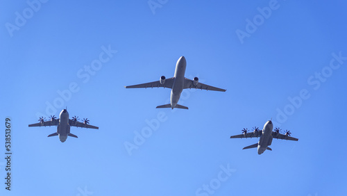 Logistic support planes flying together in the air at a military parade in Spain.