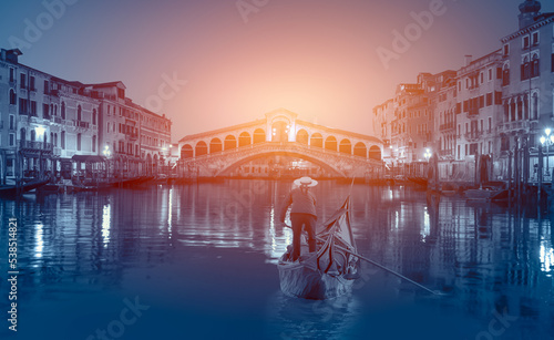 Romantic gondola ride near Rialto Bridge - Venice, Italy