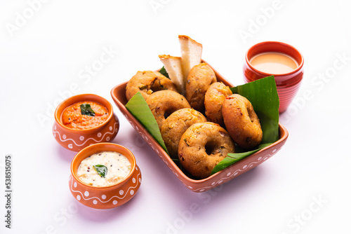 Instant leftover bread medu vada served with chutney and hot tea, Indian breakfast or snack recipe photo