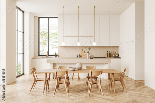 Light kitchen interior with chairs and table, meeting area and panoramic window